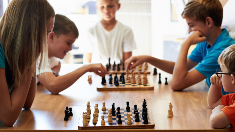 Image of children playing chess