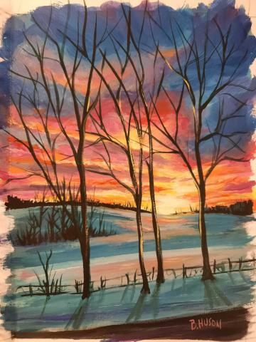 snowy scene with trees and sunset in the background